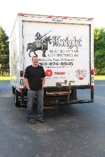 Technician In Front of Knight Heating and Air Conditioning, Inc. Truck